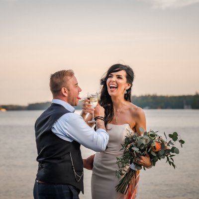 Groom Sticking out Tongue at Bride During Toast