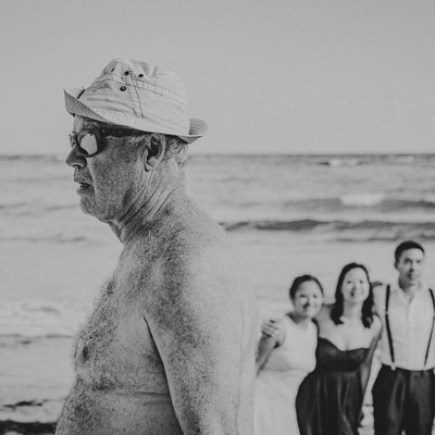 Old Fat Guy Walks in Front of Wedding Party Photo