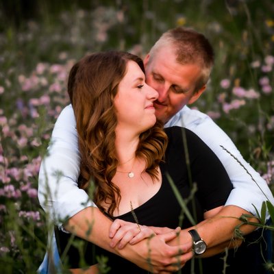 Engagement Couple in Field of Wild Flowers in Collingwood