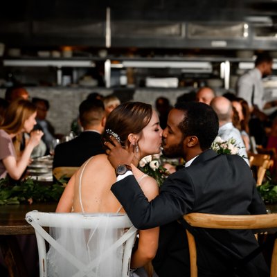 Groom Kisses Bride at Adamo Estate Winery Wedding 