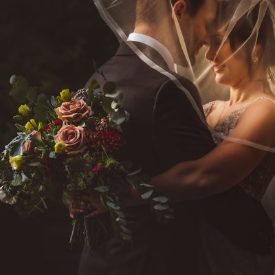 Bride Groom Under Veil in Golden Light at Graydon Hall Manor
