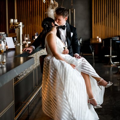 Bride Groom Kissing at the Bar:  Canoe Restaurant Photographer