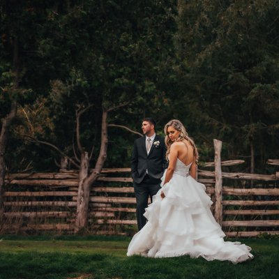 Bride Groom with Wood Fence in Background at Hockley