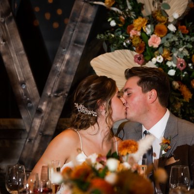 Kiss at Head Table:  Craigleith Wedding Photographer
