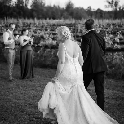 Bride Groom Walking at Adamo Estate Winery Wedding