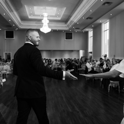 Bride Groom Reach for Each Other at First Dance