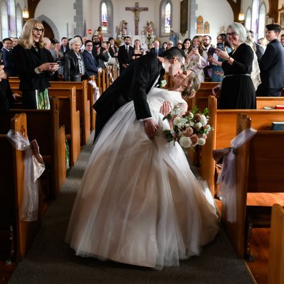 Groom Dips & Kisses Bride at Church Ceremony Exit