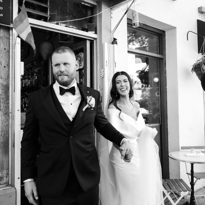 Groom Leading Bride out of Reception Hall