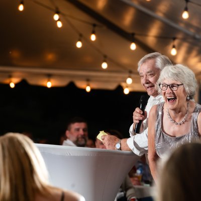 Mom and Dad Giving Speech at Backyard Wedding Reception