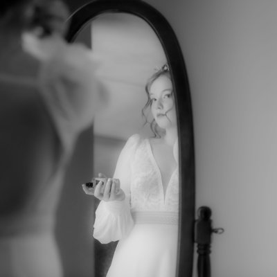 Bride Reflection in Mirror Applying Perfume