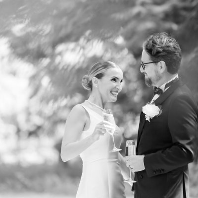 Bride Groom Enjoying Champagne During Cocktail Hour