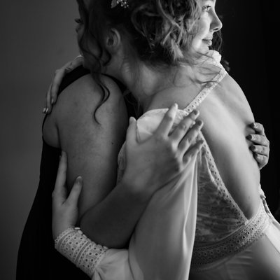 Sisters Hugging During Bride Getting Ready