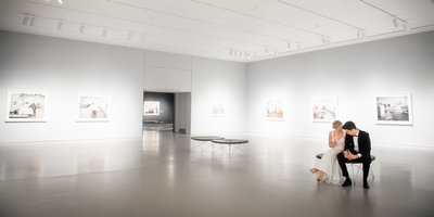Couple takes a Moment Alone in the Art Gallery