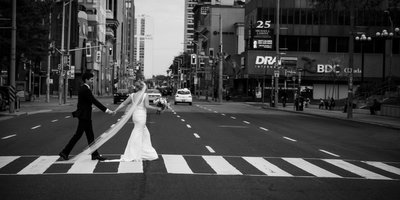 Wedding Couple Walks Across Busy City Street