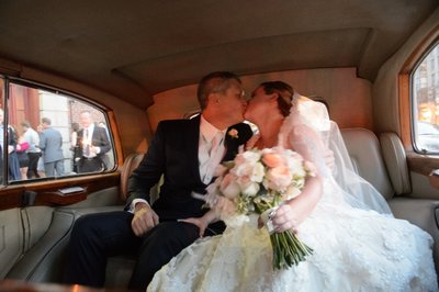 Bride Groom Kissing in Back Seat:  Toronto Wedding