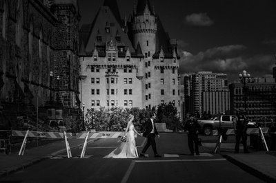 Bride Groom Walking by Castle:  Black White Wedding
