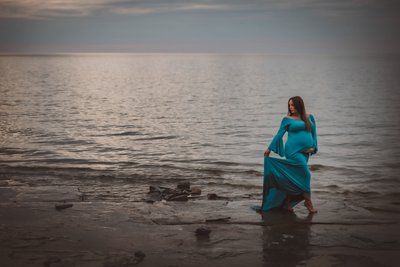 Girl Wearing Blue Maternity Dress in the Water