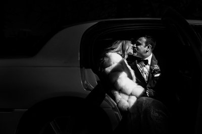 Bride Groom Kissing in Limo with Harsh Light