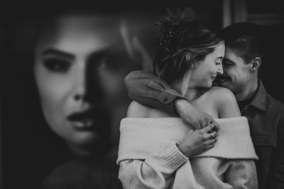 Portrait of Couple with Poster:  Toronto Photographer