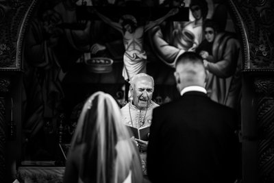 Priest Winking:  Black and White Wedding Photographer