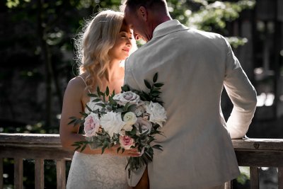 Groom in White Suit:  Millcroft Inn Wedding Photographer