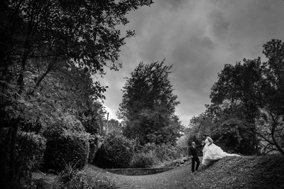 Groom Helps Bride Down Hill at Christie's Mill Wedding