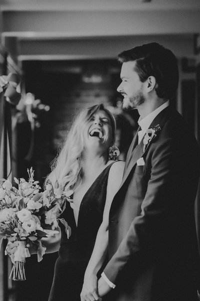 Bride and Groom Laughing Out Loud on Wedding Day
