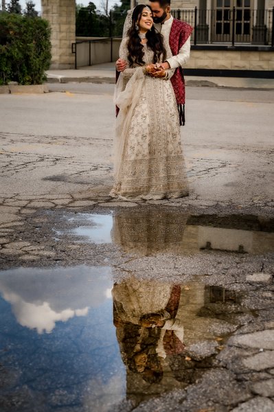 Bride Groom Reflection in Puddle at Chateau Le Jardin