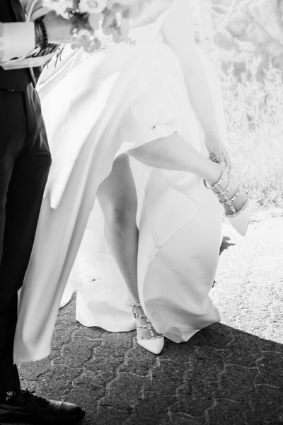 Bride Takes Off Shoes:  Black and White Photographer