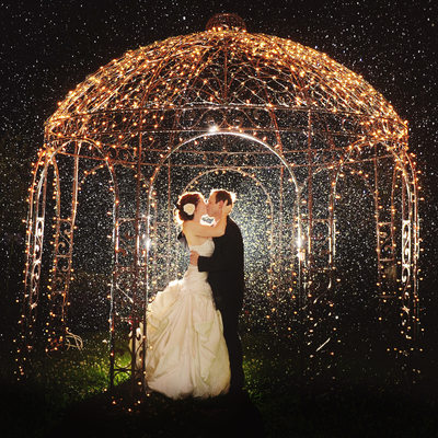 Kissing in the Rain Wedding Couple