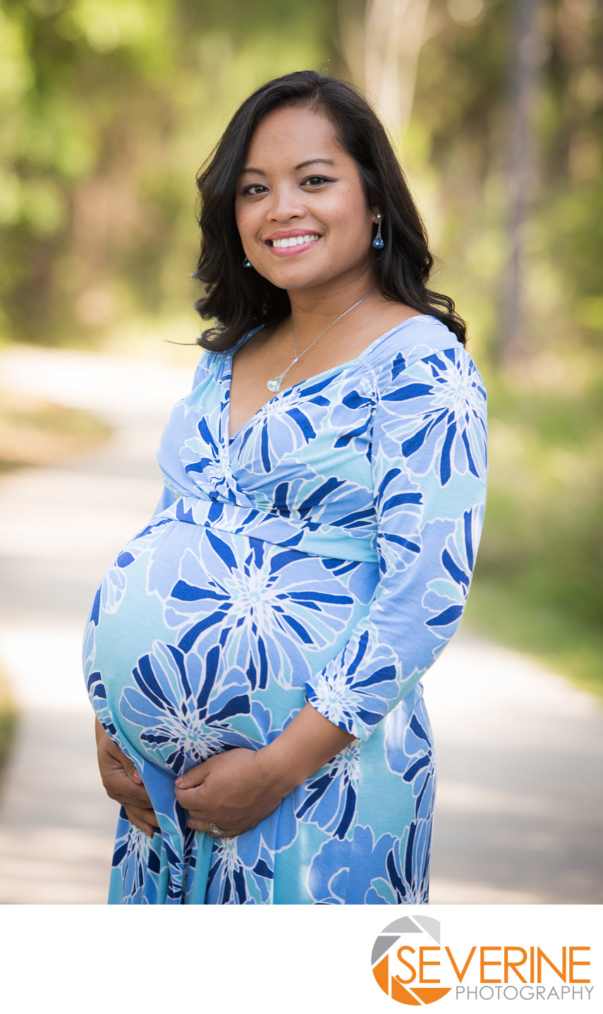 maternity photos outside with a blue dress