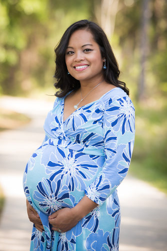 maternity photos outside with a blue dress