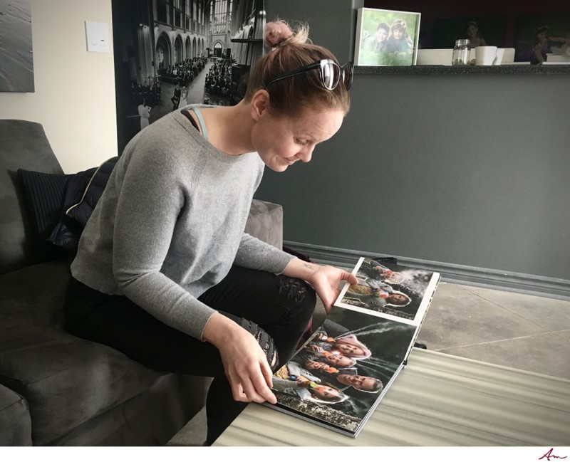 Mom viewing family portrait album.