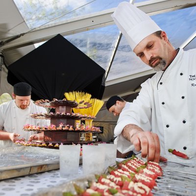 Westin chef prepares appetizers outdoor Halifax event.