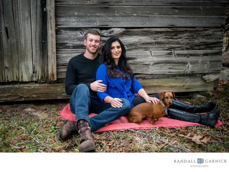 Rustic farm engagement session with cute dog