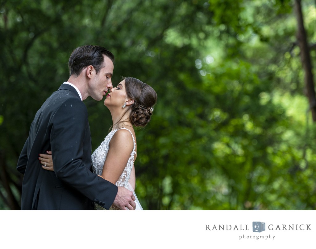 Bride and groom garden kiss Blithewold Mansion wedding