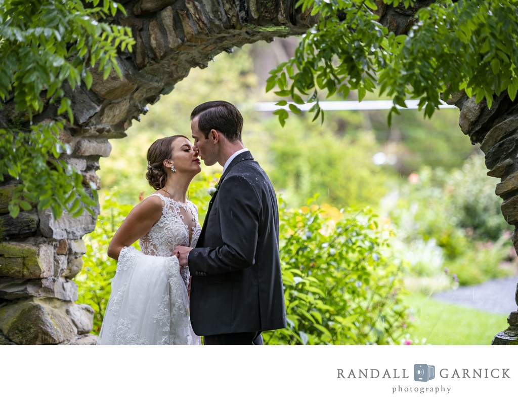 Romantic garden kiss Blithewold Mansion wedding couple