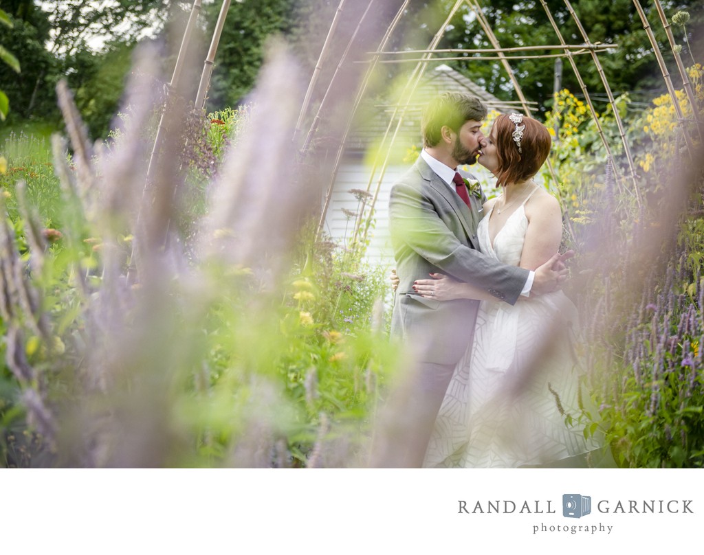 Garden embrace Blithewold Mansion wedding couple