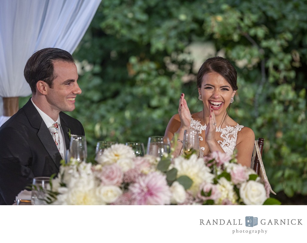 Groom and bride laughing Blithewold Mansion wedding reception