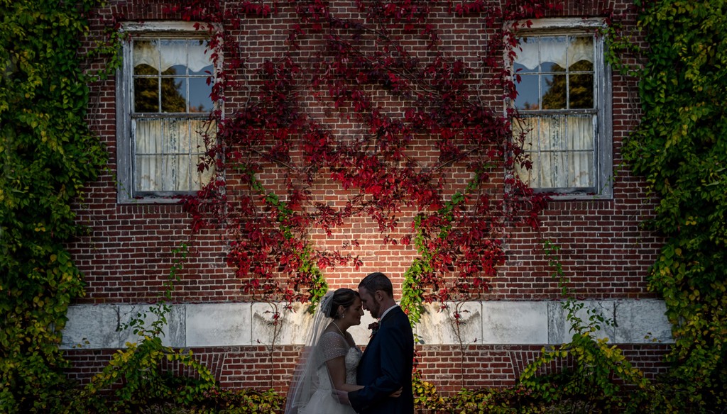 Creative portrait in front of ivy covered wall at Elm Bank weddings