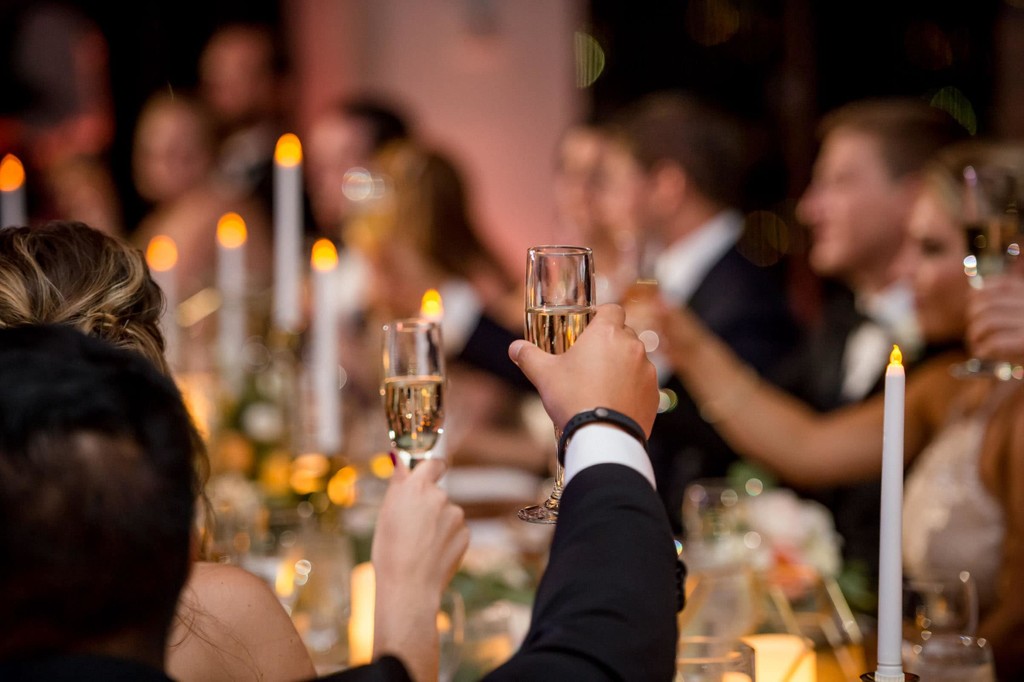 Champagne toast at a candlelit wedding reception