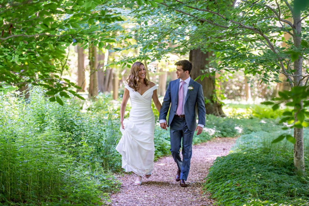 Bride and groom walking garden path Blithewold Mansion wedding