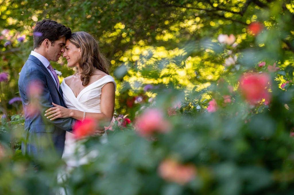 Bride and groom in the Blithewold Mansion wedding rose garden