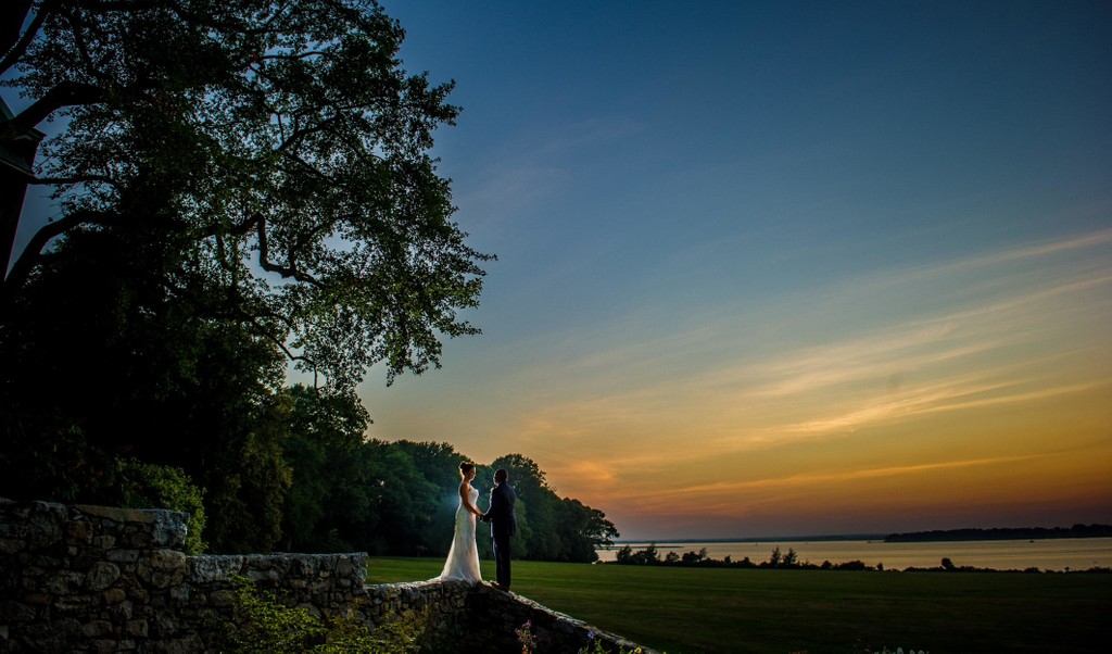 Sunset over water Blithewold Mansion wedding backdrop