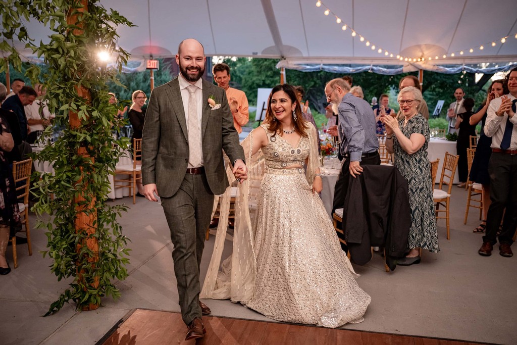 Bride and Groom Walking Through Wedding Tent at deCordova Museum Weddings