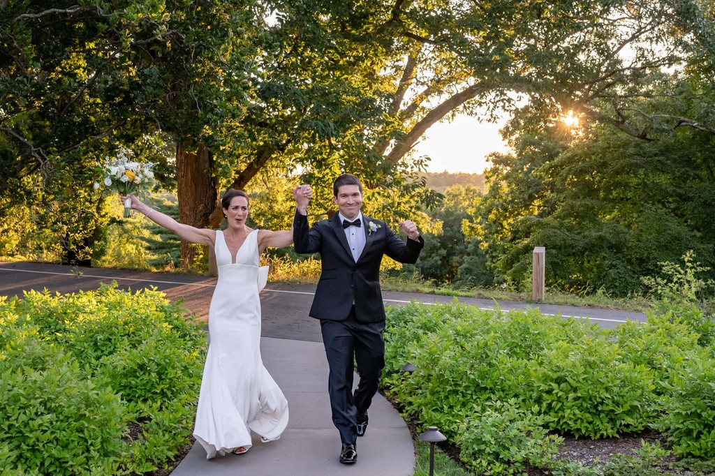 Bride and groom celebrating grand entrance at deCordova Museum weddings