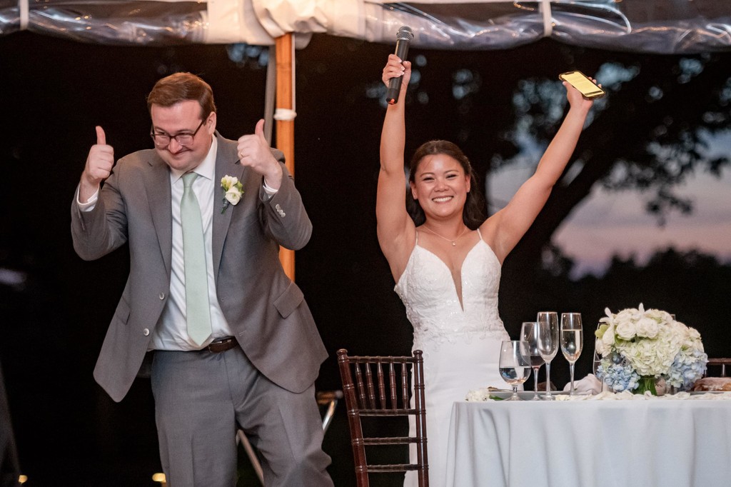 Bride and groom cheering at deCordova Museum weddings reception