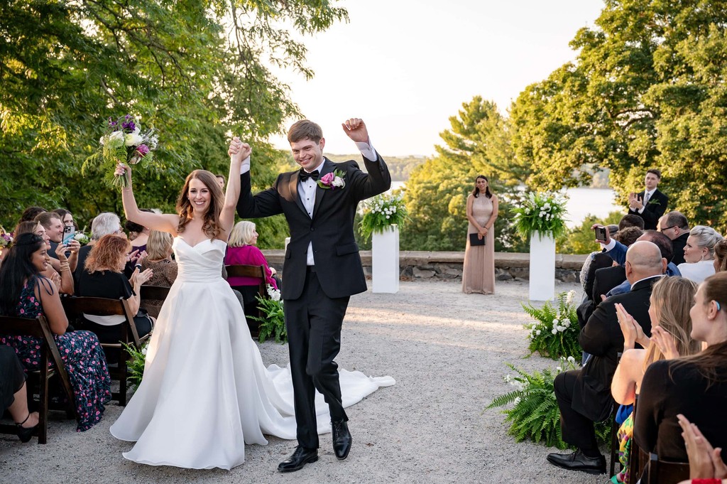 Bride and groom celebrating post-ceremony at deCordova Museum weddings