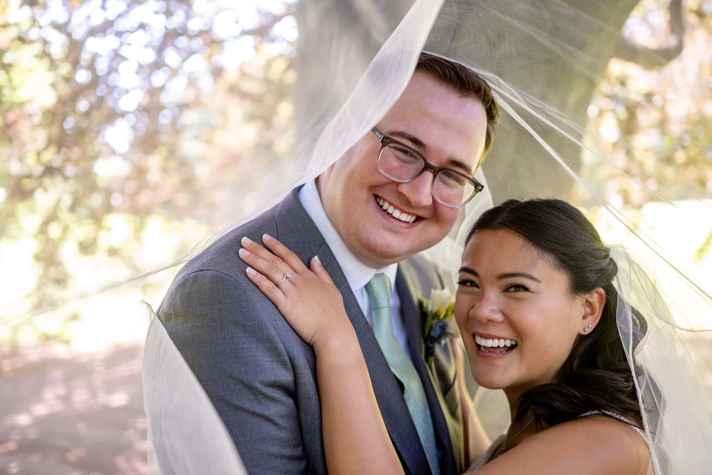 Bride and groom sharing a joyful moment at deCordova Museum weddings