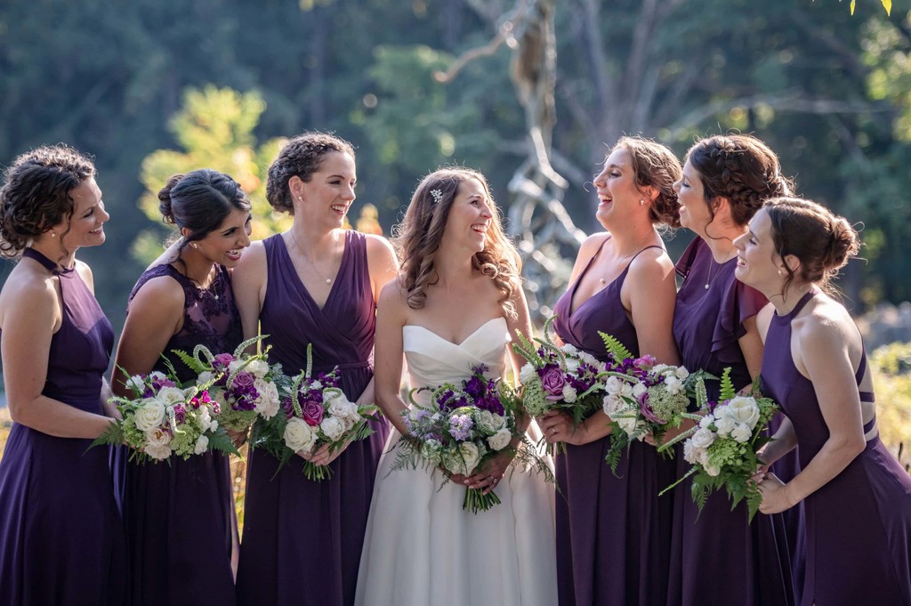 Bridesmaids in purple posing at deCordova Museum weddings